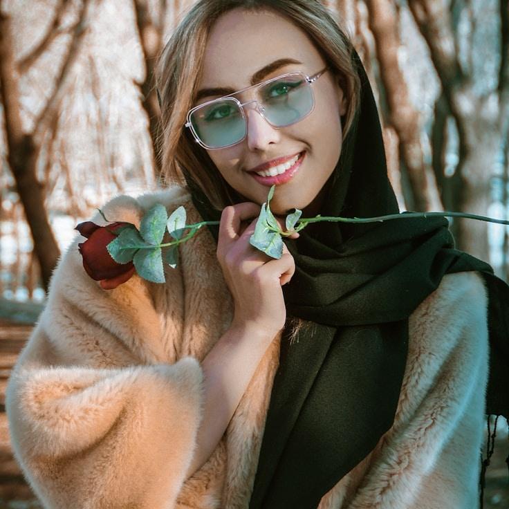 Kaveri Mehta, Lead Design Curator at Bucket Crate Parcel, reviewing corporate floral arrangements